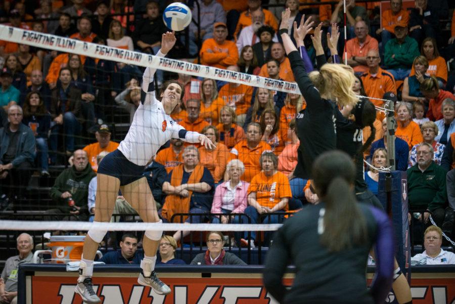 Illinois Michelle Strizak spikes the ball past Northwesterns block during the volleyball game against Northwestern at Huff Hall on Saturday. Strizak finished with six kills. 