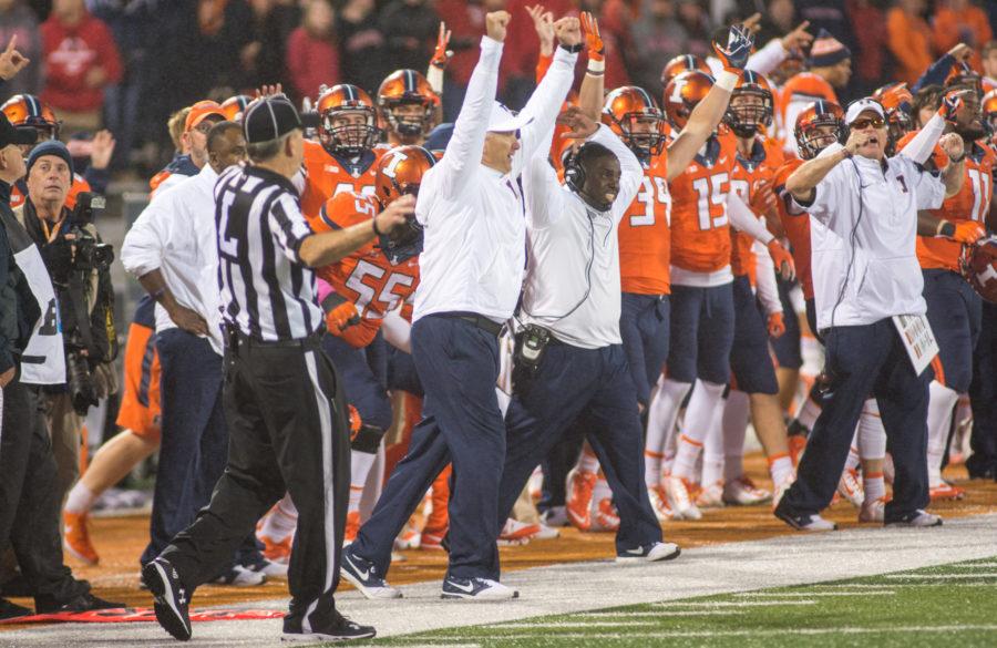 Head coach Bill Cubit and the Illinois sideline celebrate after Taylor Zalewski makes the PAT that put Illinois up 14-13 over Nebraska to win the game.