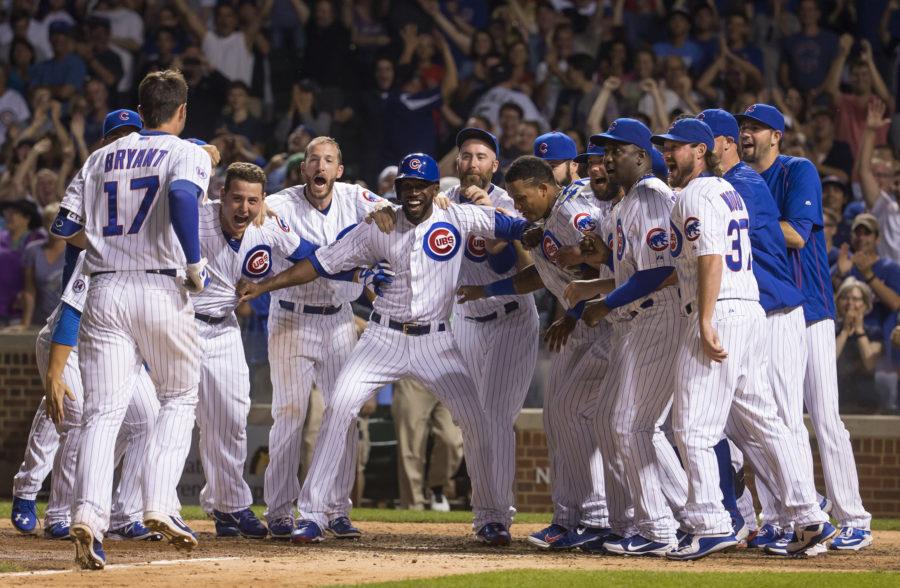 The Chicago Cubs greet Kris Bryant (17) after his walk-off home run during the ninth inning on Monday, July 27, 2015, at Wrigley Field in Chicago. (Brian Cassella/Chicago Tribune/TNS)