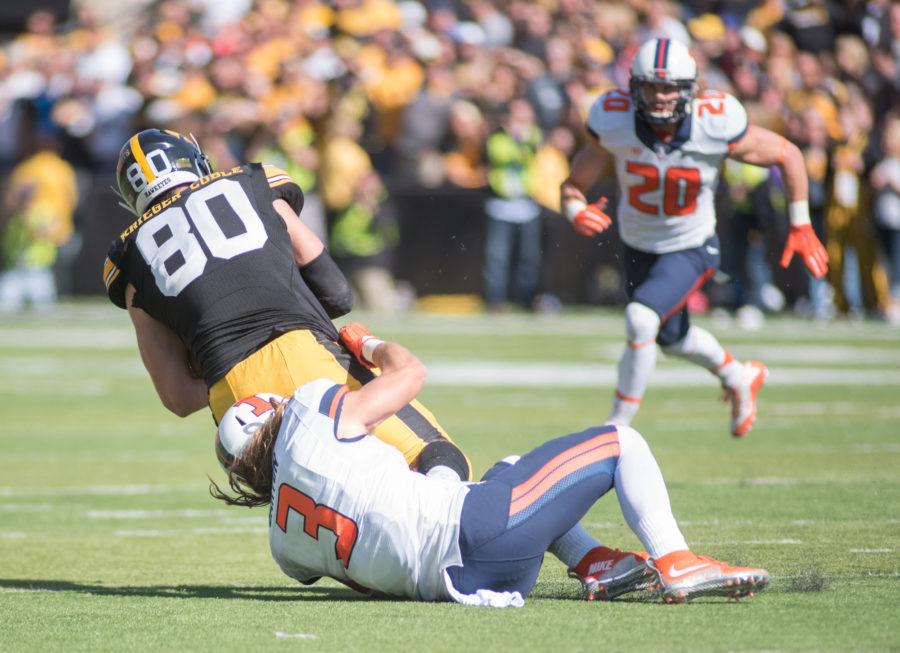 Taylor Barton safety takes down Iowa tight end Henry Krieger Coble during Saturdays game at Kinnick Stadium. Illinois lost 29-20.
