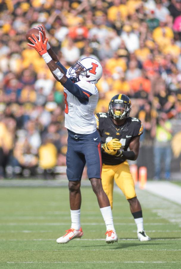 Illinois wide receiver Geronimo Allison stretches out to catch a pass in Saturdays game against Iowa at Kinnick Stadium in Iowa City. Illinois lost 20-29.