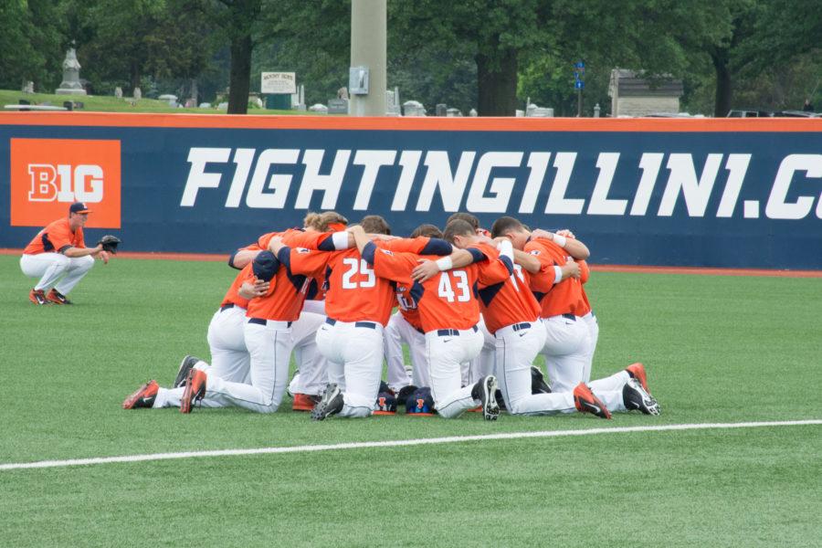 The Illini baseball team huddles before the start of their game against Notre Dame on May 30 at Illinois Field.