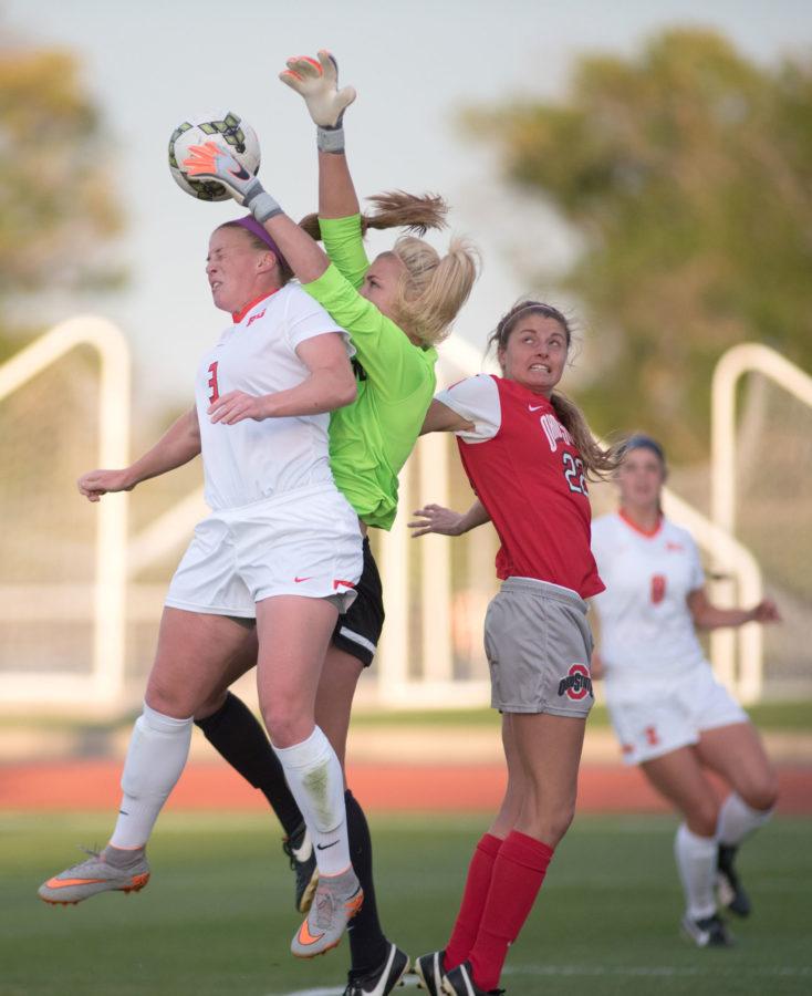 Jannelle Flaws attempts to head the call and collides with the Ohio State goalkeeper during the game  at Illinois Soccer and Track Stadium on Friday. The game ended in a 1-1 tie.