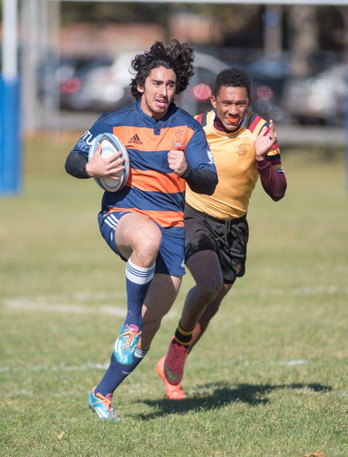 Martin Gianetti outruns a Minnesota player and scores a try during Illinois victory at the Complex Fields on Saturday afternoon.