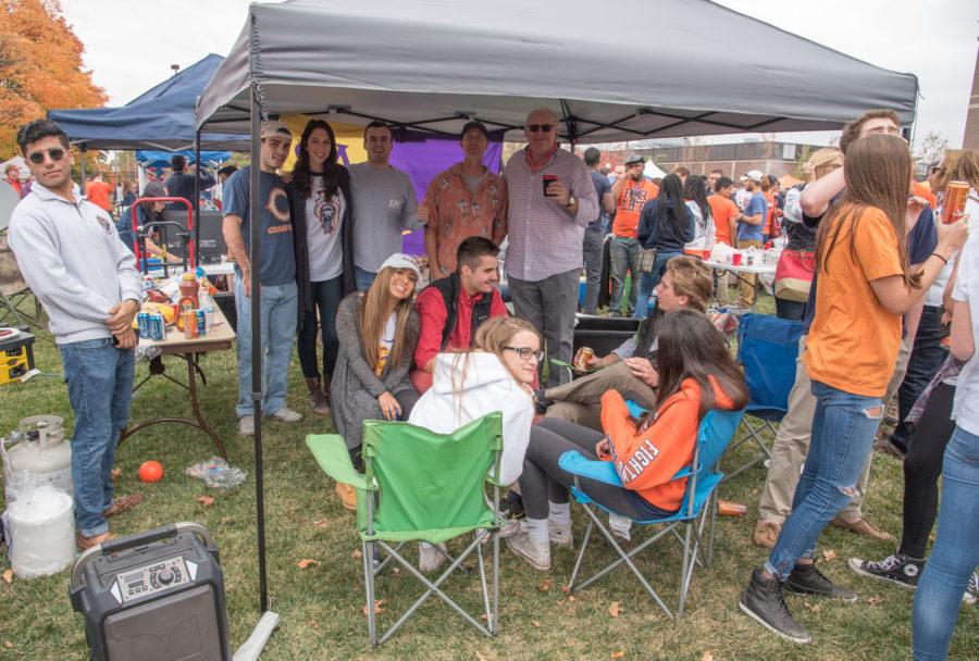 Past and current members of Sigma Alpha Epsilon celebrate Block at Grange Grove before a Homecoming football game.