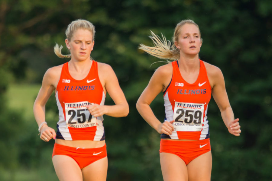 Britten Petrey(257) and Kim Seger(259) picking up the pace during warmups at the Illini Challenge 2015 at the Arboretum on September 4.