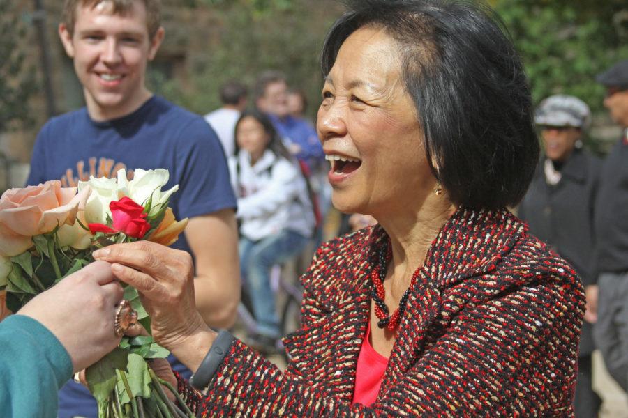 Kelly Hickey The Daily IlliniChancellor Phyllis Wise receives a rose on Wednesday, from a student in honor of her one-year anniversary as Chancellor on this campus. Wise was greeted by sixty students with roses, spanning from the Illini Union to the the Swanlund Administration Building. 