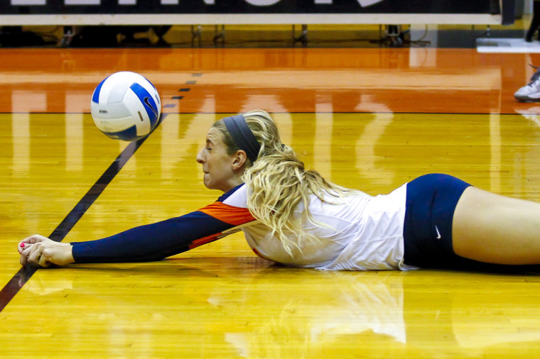 Illinois Jocelynn Birks (7) dives for the ball during the match against Washington at Huff Hall on Friday, Sept. 13, 2013.