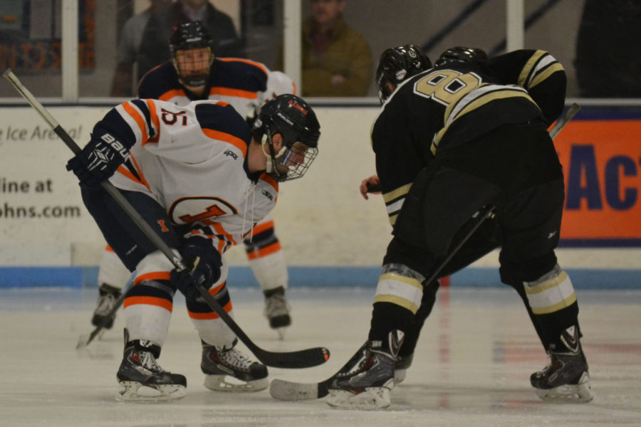Eric Cruikshank (15) faces off against Tobias Nasgarde (8) of Lindenwood during the game on February 7, 2015. The Illini lost 4-2.