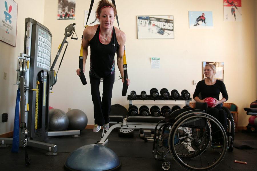 Anthony Souffle tribune news service
Paralympic Tatyana McFadden lifts her body weight during a recovery session after racing in the U.S. Paralympics Nordic Skiing National Championships, January 2014, at the National Ability Center in Park City, Utah. At right is teammate Beth Requist. 