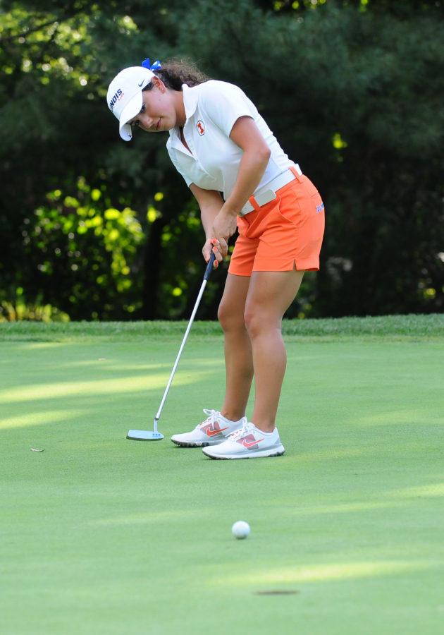 Illini womens golfer Dana Gattone tracks a putt. Gattone stands at 4 foot 10 inches and came to Illinois from Saint Viator High School.