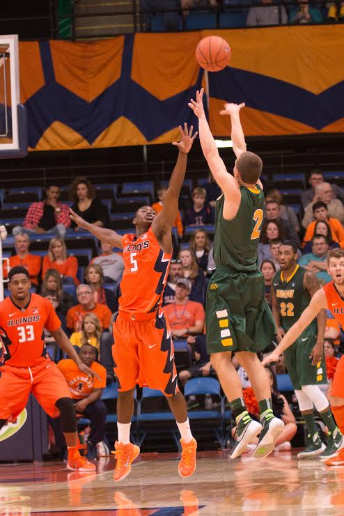 Jalen Coleman-Lands contests a Paul Miller three-point shot during Illinois game against North Dakota State on Sunday.