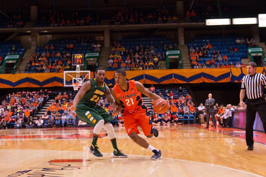 Illinois Malcolm Hill (21) dribbles around his defender during the game against North Dakota State at the Prairie Capital Convention Center in Springfield, Illinois, on Sunday, November 15, 2015. The Illini won 80-74.