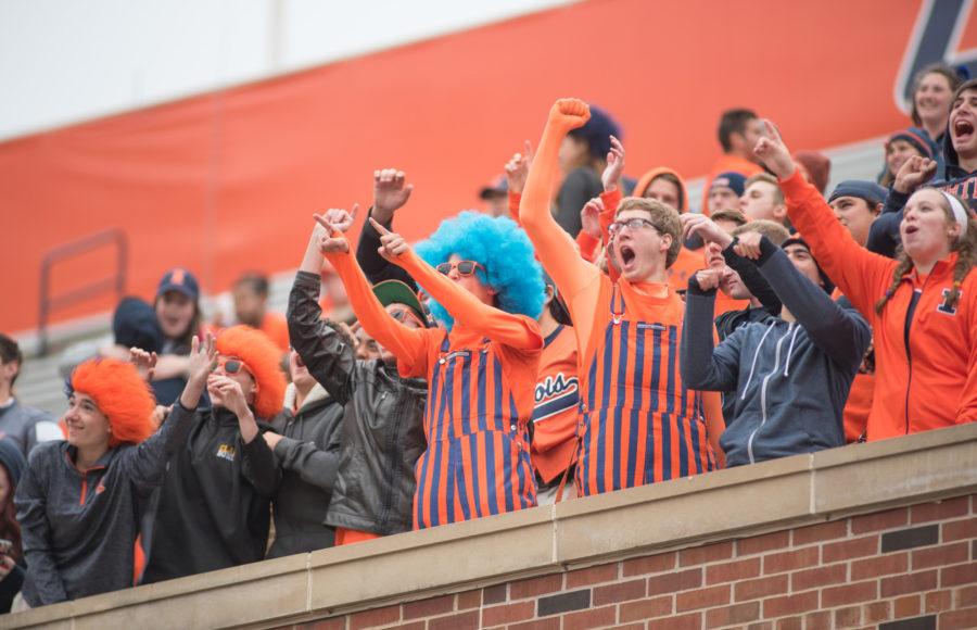 Members of Illinois student section, Block I, cheer on the Fighting Illini during their game against Nebraska on Saturday at Memorial Stadium. Illinois won 14-13.
