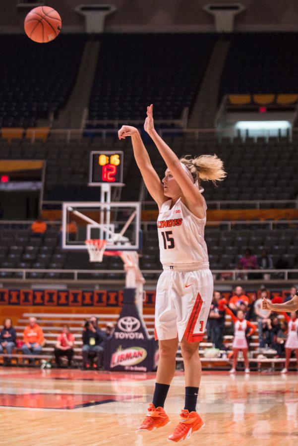 Illinois Kyley Simmons attempts to sink a three-pointer during the match against Minnesota at the State Farm Center on Thursday.  The Illini won 95-69.