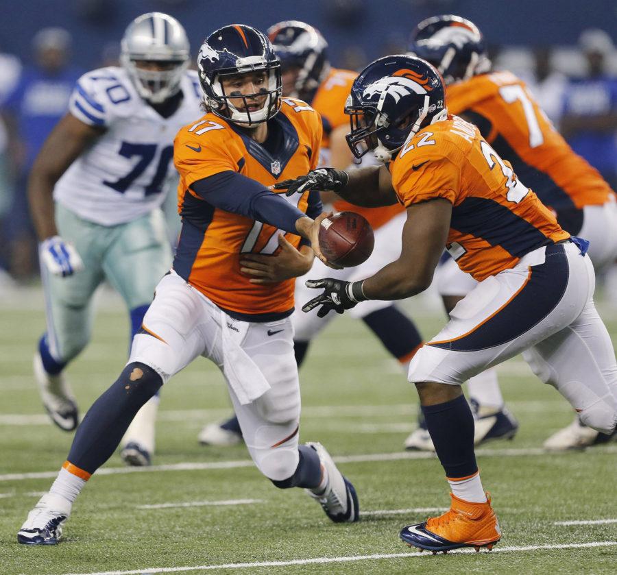 Denver Broncos quarterback Brock Osweiler hands off to running back C.J. Anderson against the Dallas Cowboys at AT&T Stadium in Arlington, Texas, on Thursday, Aug. 28, 2014. The Broncos won, 27-3. (Ron T. Ennis/Fort Worth Star-Telegram/MCT)