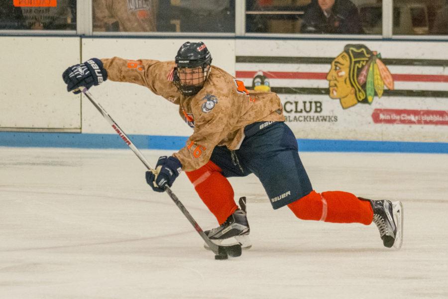 John Olen sends a pass across the ice during the game against Iowa State at the Ice Arena on Saturday, Nov. 14. Illinois lost 3-2 in a shootout.