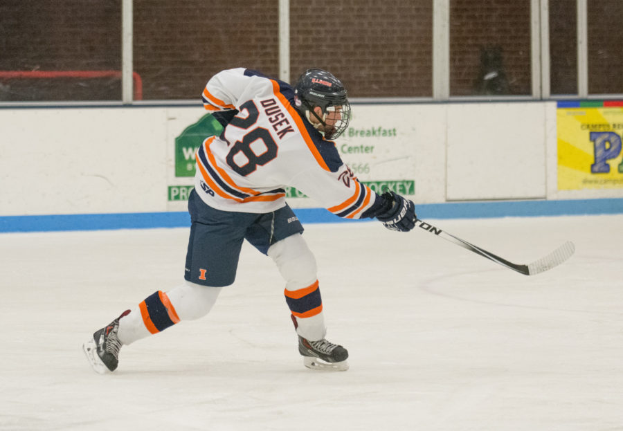 Aaron Dusek takes a shot during the game against Indiana at the Ice Arena on Saturday, Nov. 6. Illinois won 5-2.