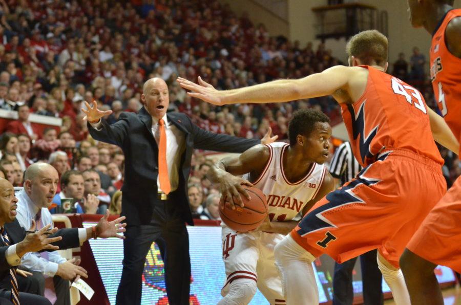 Senior point guard Kevin Yogi Ferrell holds the ball during IUs game against Illinois on Tuesday in Assembly Hall. Ferrell passed the Hoosier all-time assist record Tuesday with 553.