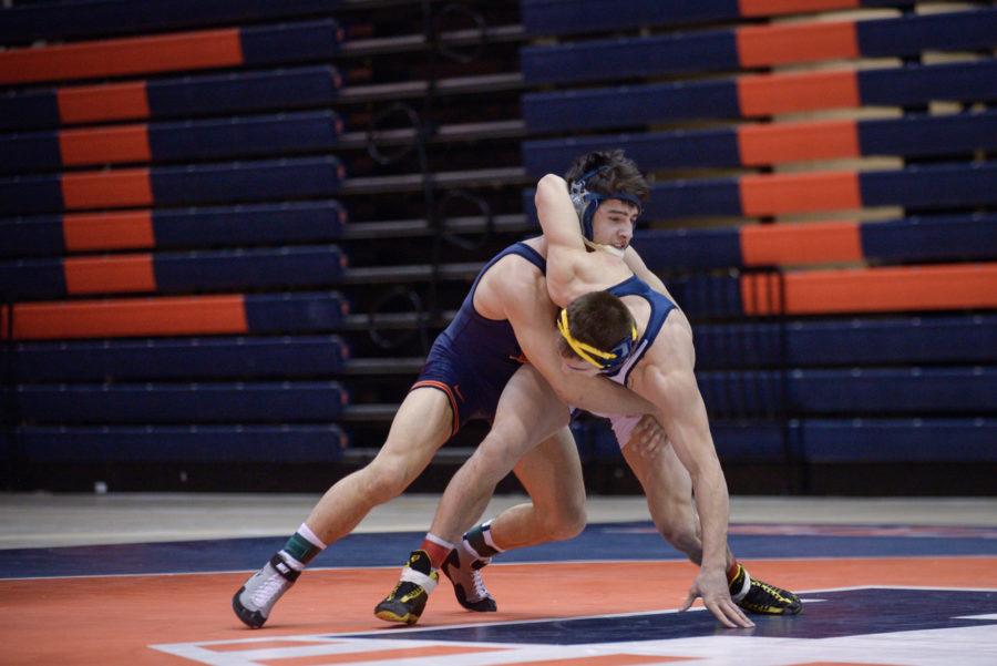 Illinois Isaiah Martinez attempts to press Kent States Ian Miller to the ground during the match at Huff Hall on Sunday, February 15, 2015.The Illini won 38-0.