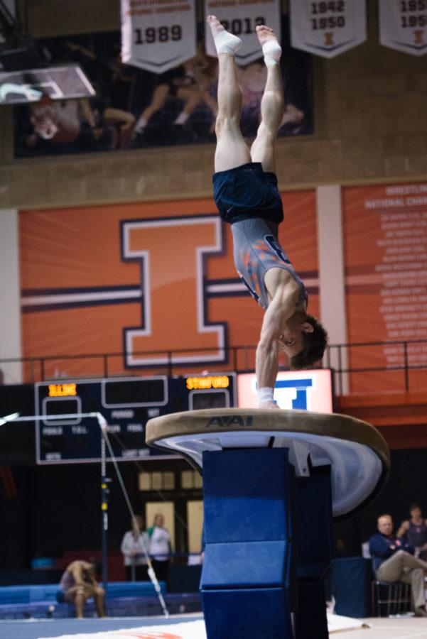 Illinois Bobby Baker launches off the vault during the meet against Stanford at Huff Hall on Friday, March 6, 2015.The Illini lost 21-9.