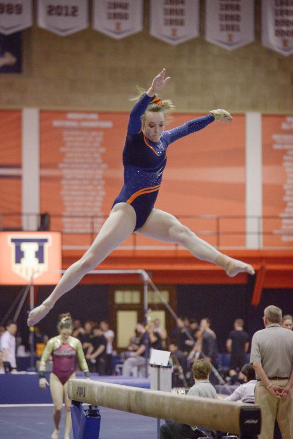 Illinois+Becca+Cuppy+performs+a+routine+on+the+balance+beam+against+Minnesota+at+Huff+Hall+on+Feb.+7.+Cuppy+is+in+her+first+semester+at+Illinois+after+graduating+high+school+early.