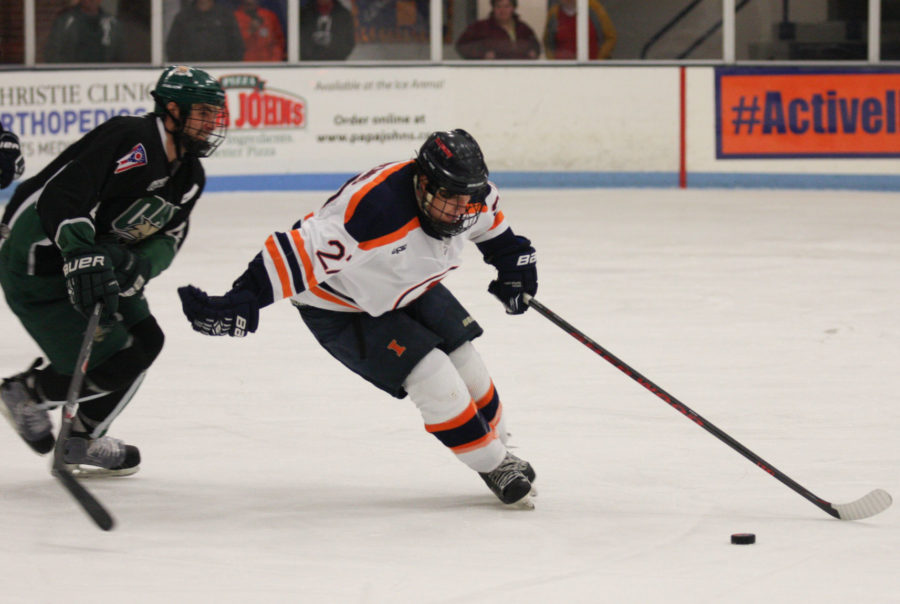 Illinois Kyle Varzino (27) tries to keep the puck away from Ohio during the Ohio hockey game at the Ice Arena on Oct. 24. The Illini had a pair of matches this weekend against Aurora.