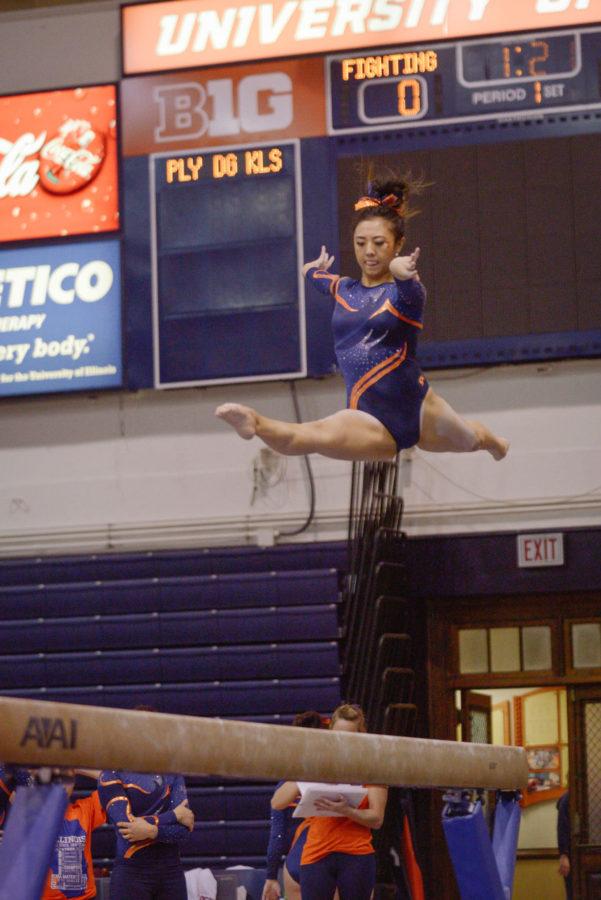 Illinois Sunny Kato performs a routine on the balance beam during the meet against Minnesota at Huff Hall on Saturday, February 7, 2015. The Illini won 195.775-195.375.
