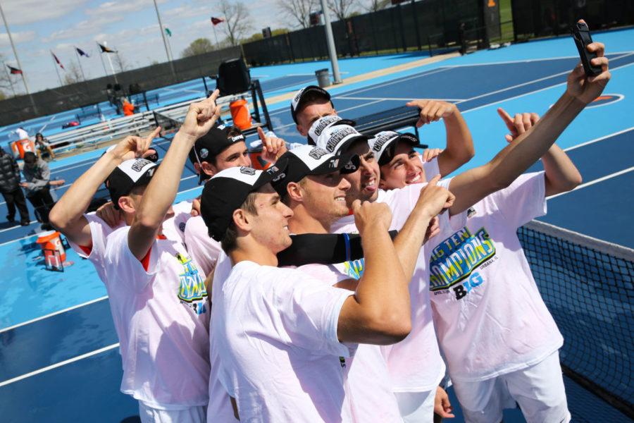 The Fighting Illini mens tennis team take a picture together as champions after the Big Ten Mens Tennis Tournament final against Ohio State at the Khan Outdoor Tennis Complex, on Sunday. The Illini won 4-0.