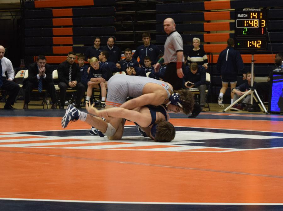Illinois Mousa Jodeh knocking down Penn States James Gulibon during the wrestling match vs. Penn State at Huff Hall on Saturday January 23, 2016. The Illini lost 19-1.