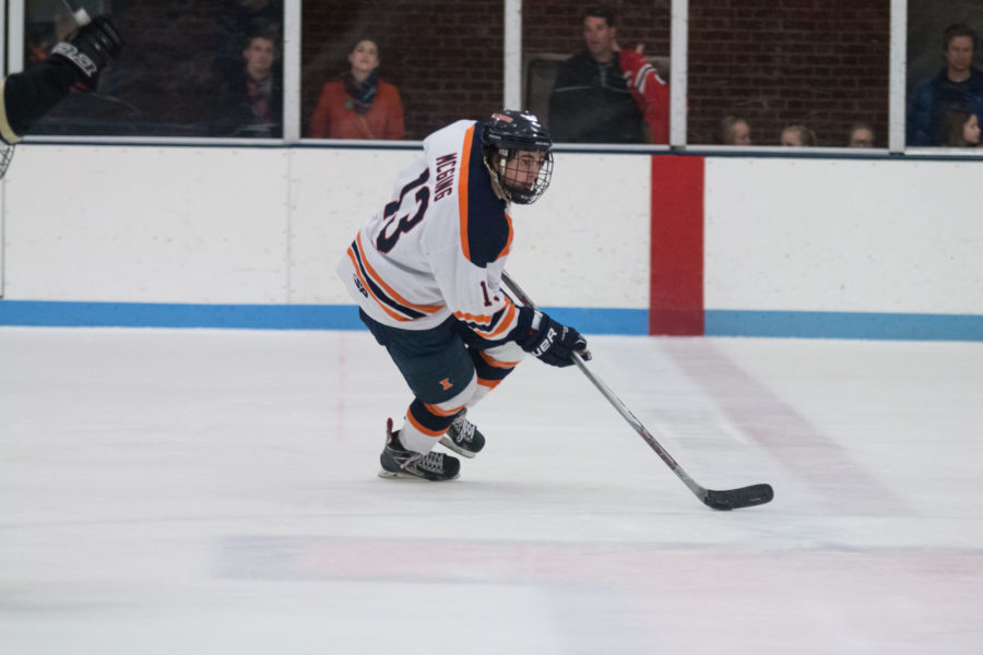 Illinois James McGing carries the puck up the ice during the game against Lindenwood University at the Ice Arena on Saturday. The Illini lost 4-1.