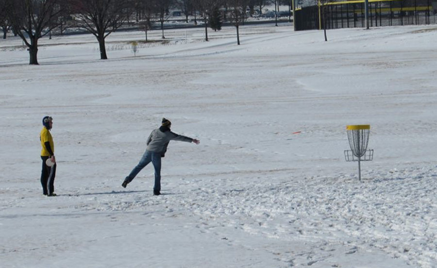 A team participating in the 4th annual Ice Bowl tosses a shot toward the basket.