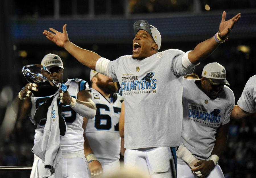 Carolina Panthers quarterback Cam Newton (1) yells as he celebrates with the the team after winning the NFC Championship over the Arizona Cardinals on Sunday, Jan. 24, 2016, at Bank of America Stadium in Charlotte, N.C. (David T. Foster III/Charlotte Observer/TNS)