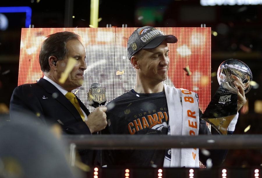 Denver Broncos starting quarterback Peyton Manning, right, holds the Lombardi Trophy after the Broncos 24-10 win against the Carolina Panthers in Super Bowl 50 at Levis Stadium in Santa Clara, Calif., on Sunday, Feb. 7, 2016. The Broncos won, 24-10. (Nhat V. Meyer/Bay Area News Group/TNS)