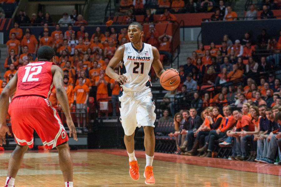 Illinois Malcolm Hill brings the ball up the court during the game against Ohio State at the State Farm Center on Thursday, January 28. The Illini lost in overtime 68-63.
