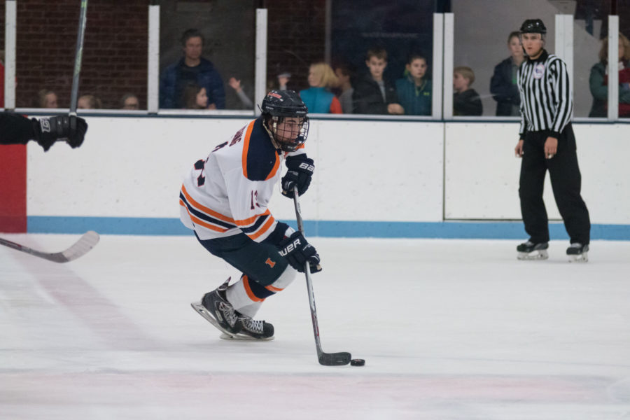 Illinois James Mcging carries the puck up the ice during the game against Lindenwold University at the Ice Arena on Saturday, January 30. The Illini lost 4-1.