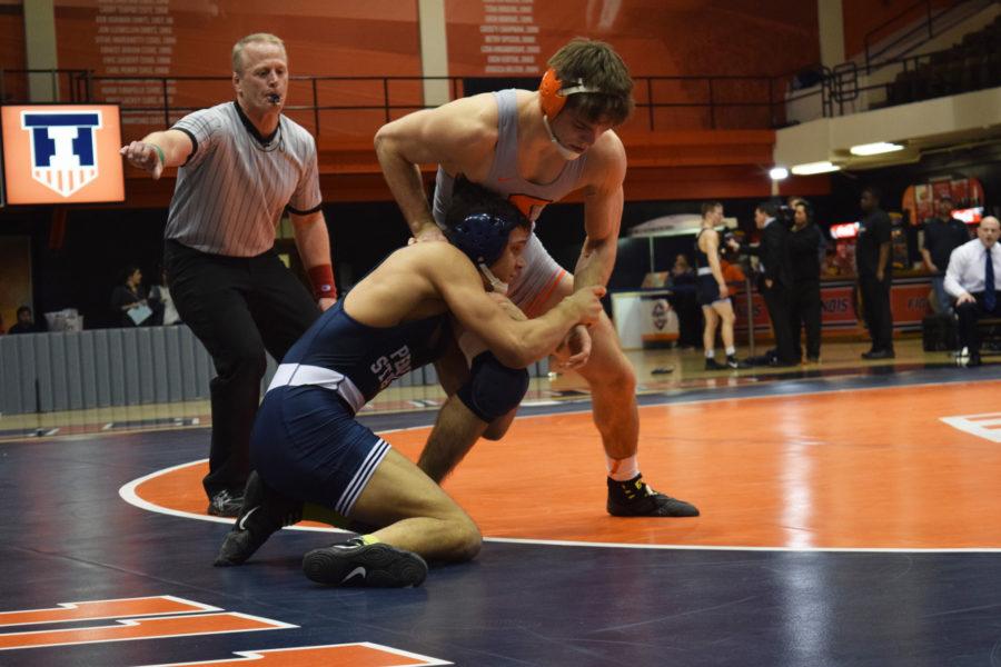 Illinois Steven Rodrigues takes ahold Penn States Shakur Rasheed during the wrestling match vs. Penn State at Huff Hall on Saturday January 23, 2016. The Illini lost 15-30.