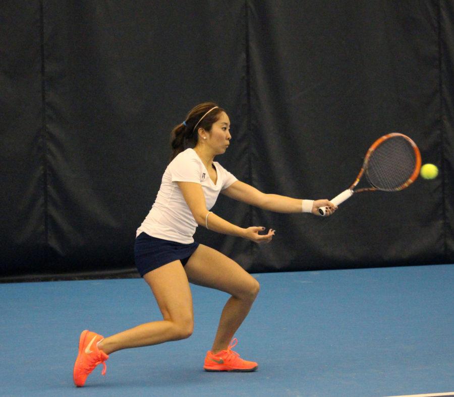 Louise Kwong rallys the ball at the Atkins Tennis Center on February 13, 2016. Illini beat South Florida 5-2