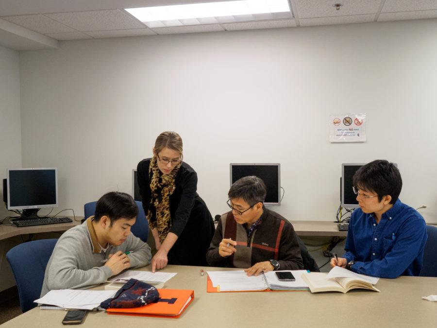 Teacher Amber Dunse  talks with students during discussion at the Intensive English Institute on Thursday.