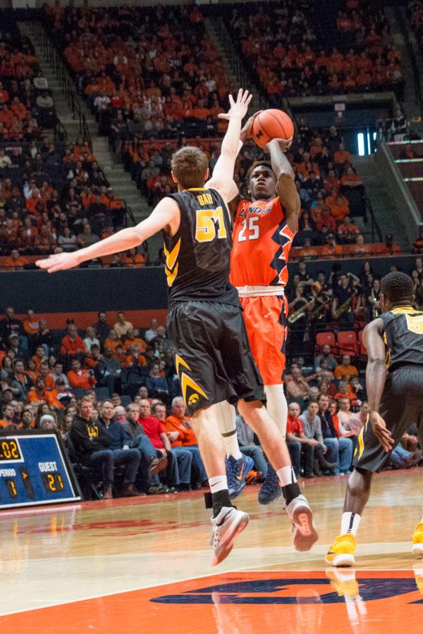 Illinois' Kendrick Nunn shoots a three over Iowa's Nicholas Baer during the game against Iowa at the State Farm Center on Feb. 7. The Illini lost 77-65.