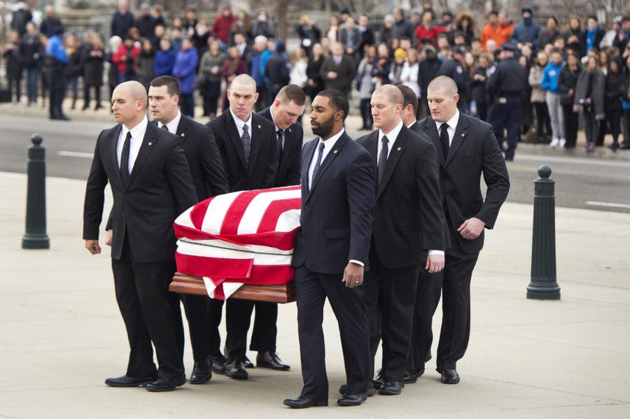 Pallbearers carry the body of Justice Antonin Scalia into the Supreme Court where he will lie in repose on Feb. 19, 2016, ahead of his burial tomorrow in Washington, D.C. (Tom Williams/Congressional Quarterly/Newscom/Zuma Press/TNS) 