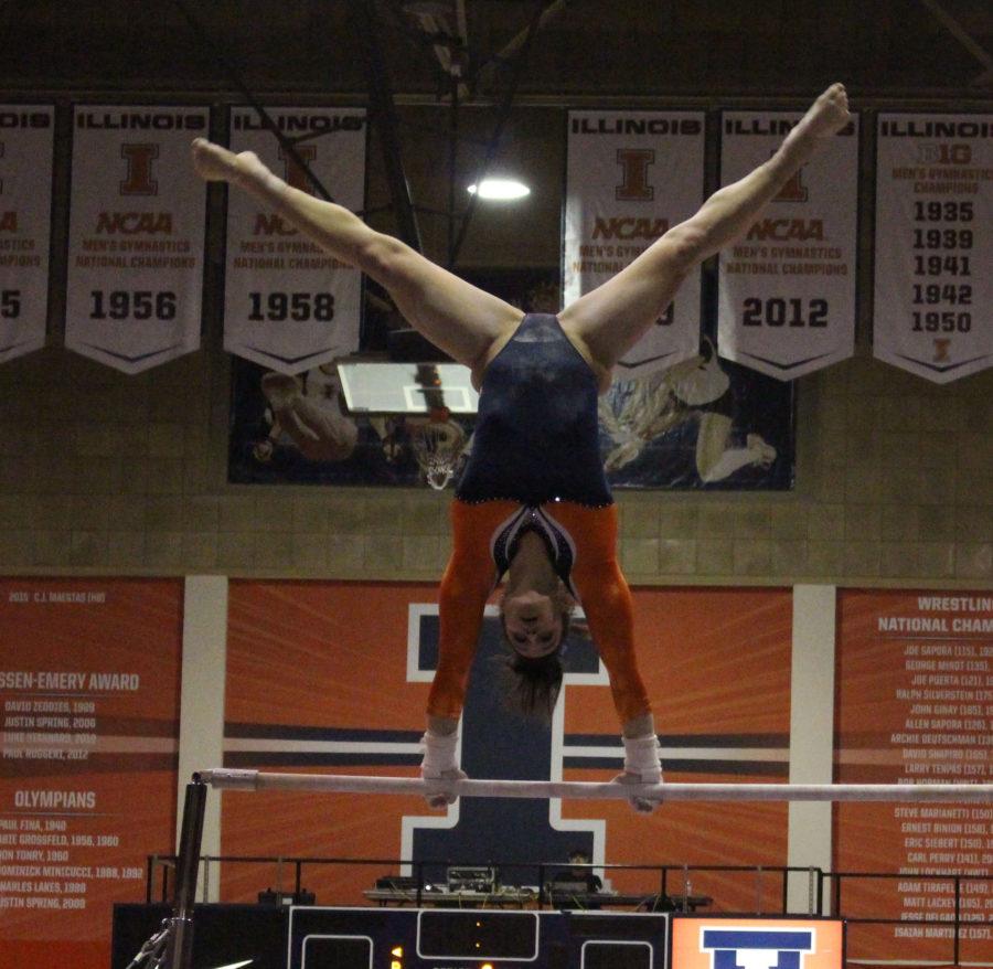 Giana OConnor on the bars during the match against Michigan at Huff Hall on January 22, 2016. Michigan won 196.825 to 195.15.