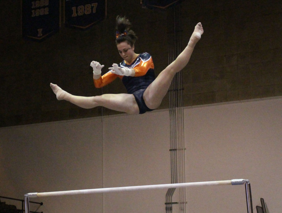 Giana OConnor on the bars during the match against Michigan at Huff Hall on January 22, 2016. Michigan won 196.825 to 195.15.