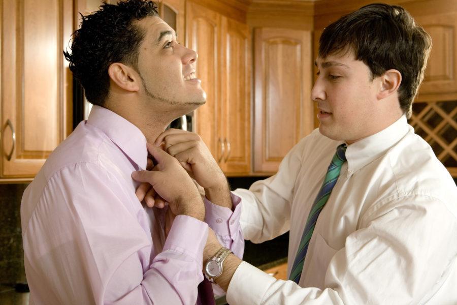 Men tying a necktie
