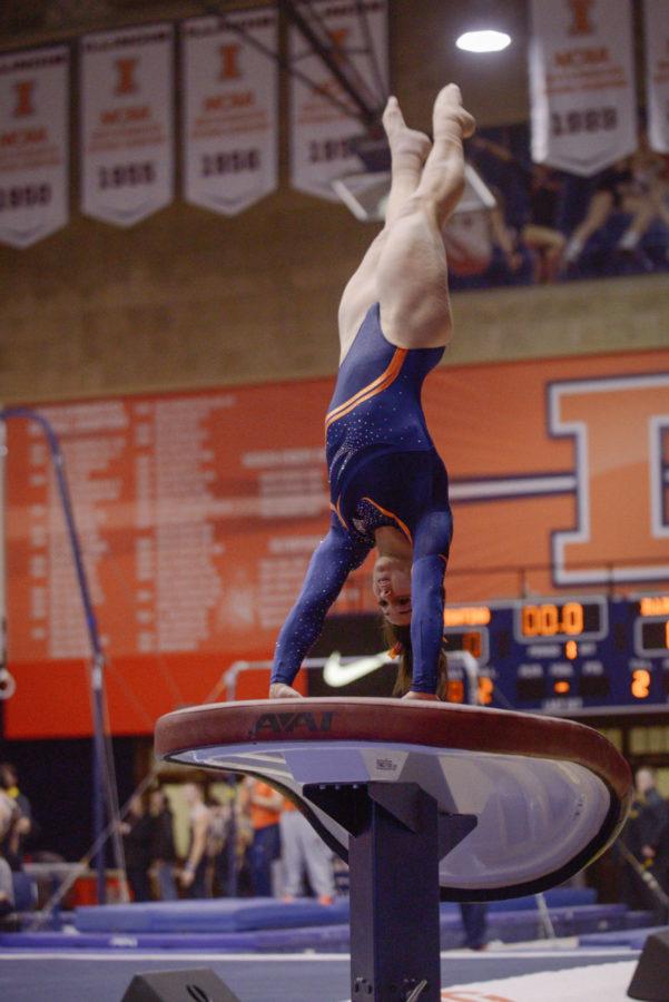Illinois Giana OConnor lifts off from the vault during the meet against Minnesota at Huff Hall on Saturday, Feb. 7. The Illini won 195.775-195.375.