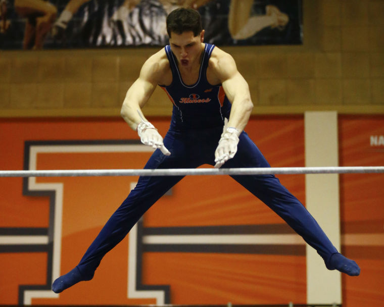 Illinois Vince Smurro competes his high bar routine during the Gym Jam against Iowa at Huff Hall on Saturday, Feb. 16, 2013.
