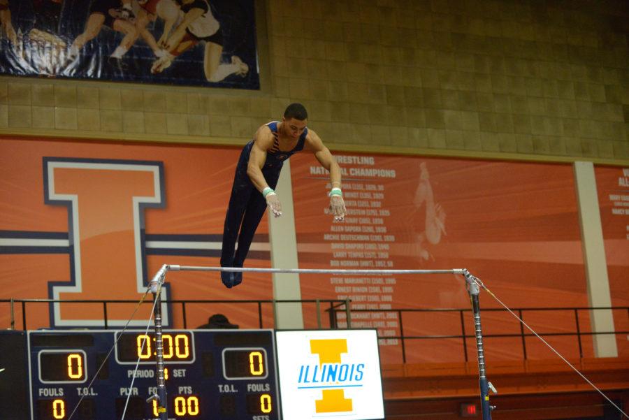 Chandler Eggleston performs the high bar routine against Ohio State at Huff Hall on Sunday, Jan. 26rd, 2014.