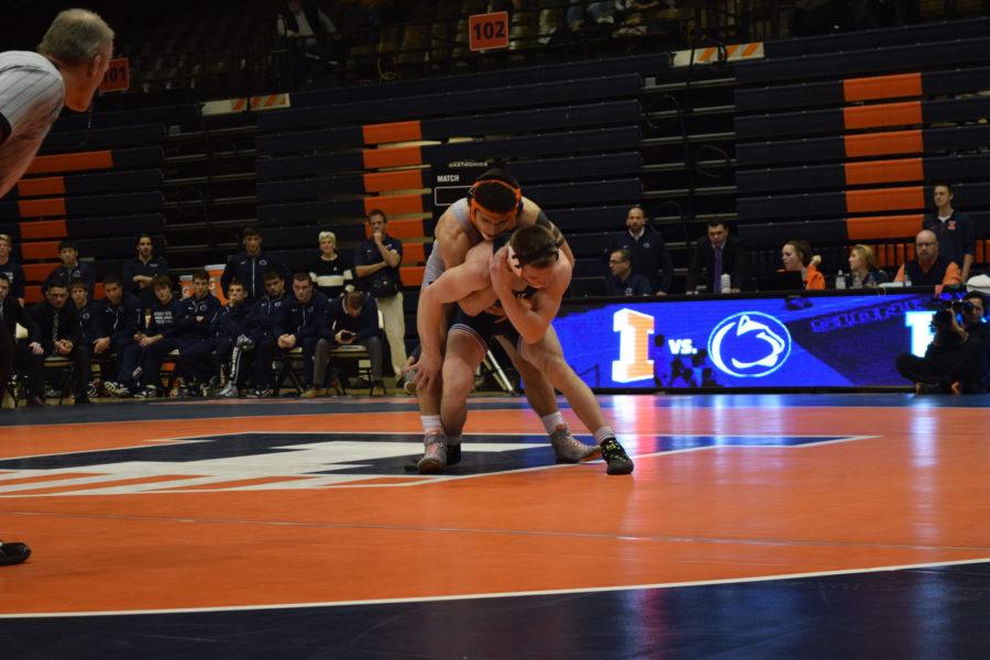 Illinois Isaiah Martinez takes a hold of Penn States Jason Nolf during the wrestling match vs. Penn State at Huff Hall on Saturday January 23, 2016. The Illini lost 19-1.