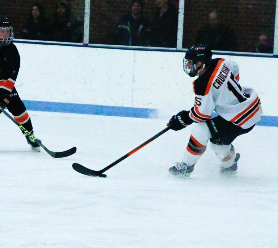 Illinois Eric Cruickshank  defends the puck during the game against Indiana Tech at the UI Ice Arena on Friday, February 27, 2016.