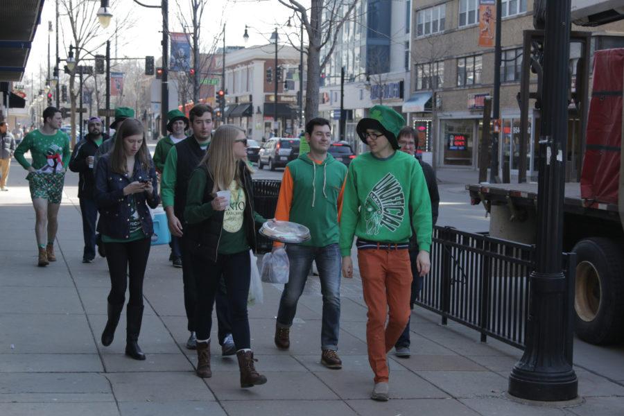Those partaking in Unofficial are donning their green apparel throughout Campustown on Friday.
